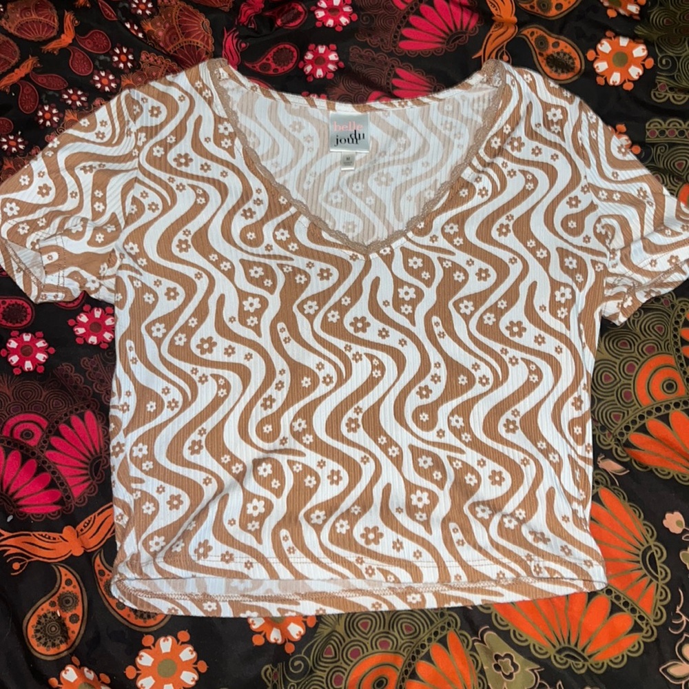 woman’s brown and white patterned lacy crop top